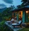 Cozy Coorg homestay surrounded by lush greenery, with mountain views, outdoor lounge chairs, and warm interior lighting.