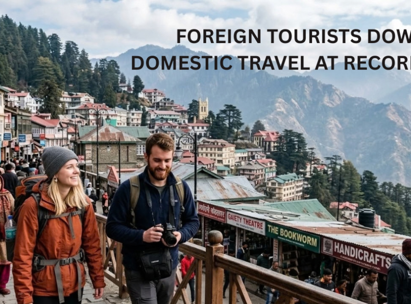 Crowded hill-station street with domestic and foreign tourists, mountain views, and colonial buildings. Text overlay reads, “Foreign Tourists Down, Domestic Travel at Record High.”