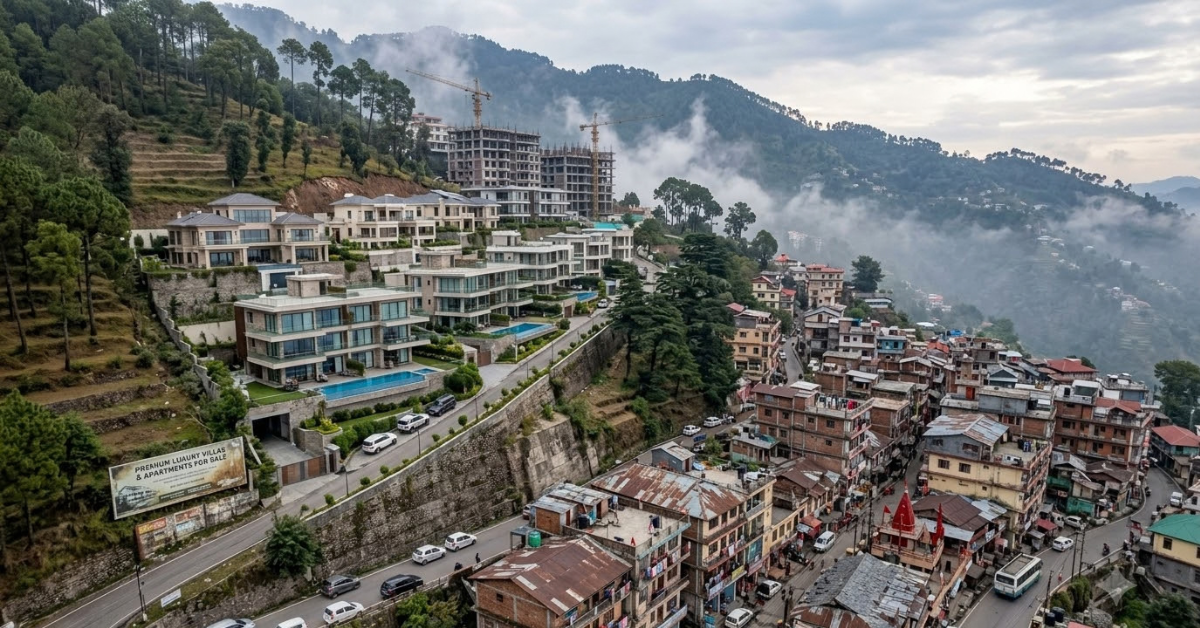 Luxury villas and apartments in Kasauli overlooking a misty mountain landscape, contrasted with densely packed residential buildings and ongoing real estate development in the hills.